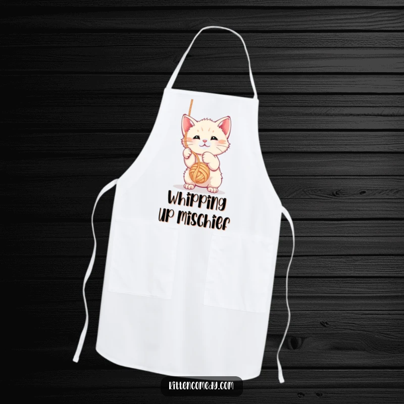 Funny kawaii kitten apron showing the little cat hilariously entangled with a ball of yarn.
