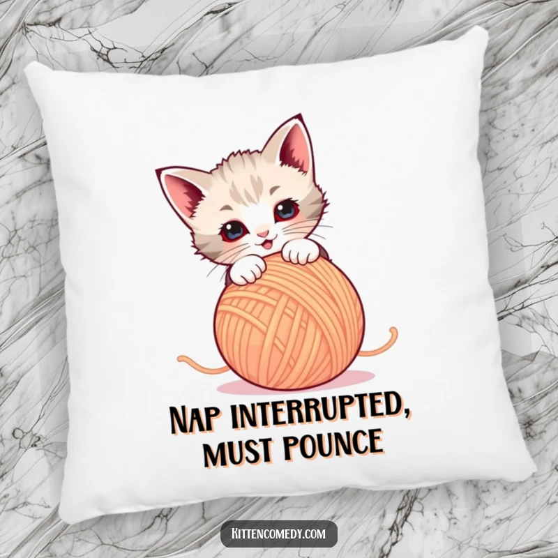 Funny Pillow: A kitten intensely pounces on a ball of yarn. Cozy, cute, and hilariously playful.