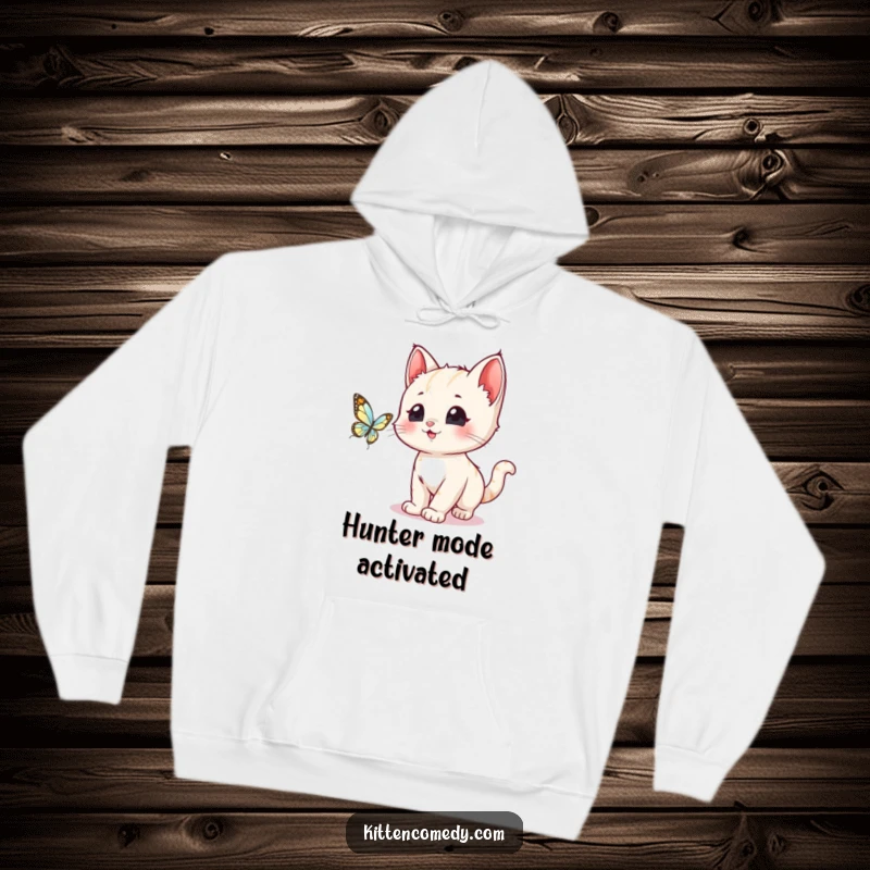 Funny, wide-eyed kawaii kitten in a whimsical chase after a shimmering butterfly, featured on a warm hoodie.