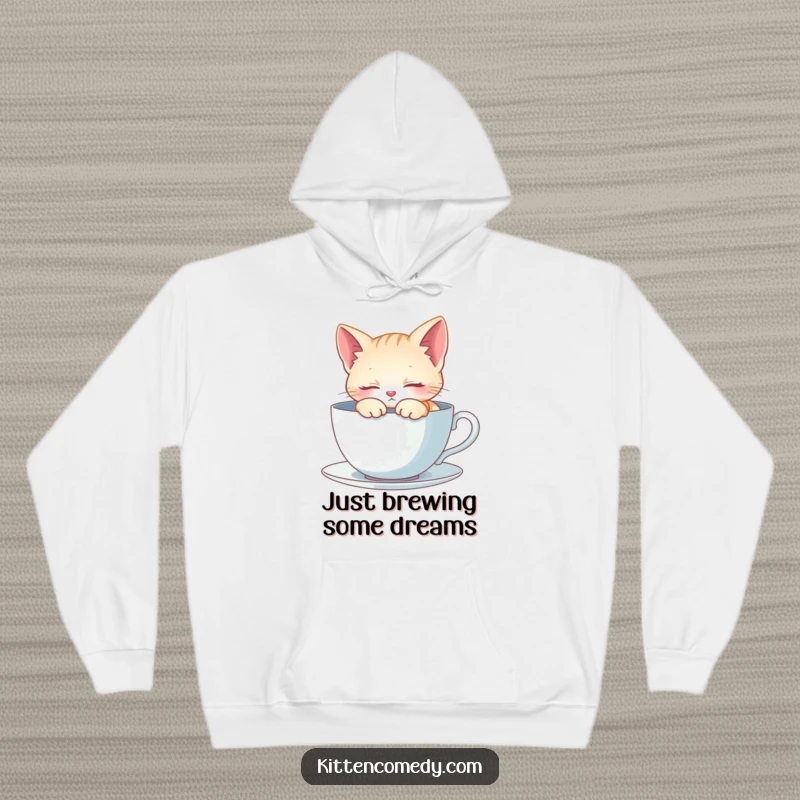 Funny Hoodie: A tiny kitten sleeps soundly within a giant teacup. Soft, warm, and incredibly charming.