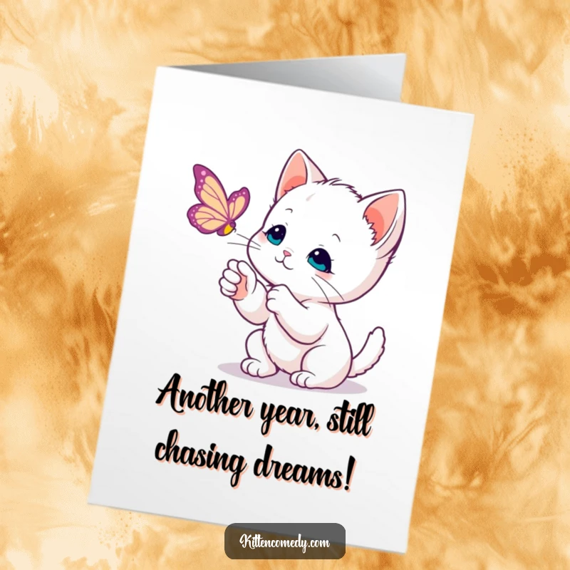 Funny Free Printable birthday card showing a kawaii kitten gently swiping at a floating butterfly with curious, focused eyes.