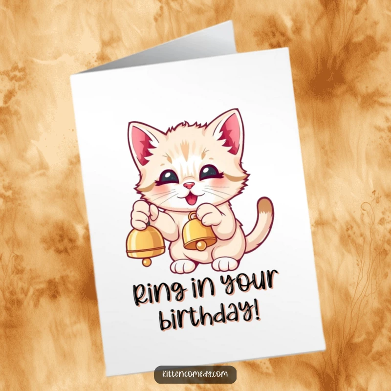 Funny Free Printable Birthday Card: A Kawaii kitten excitedly batting at a dangling bell with eyes full of pure, happy delight.