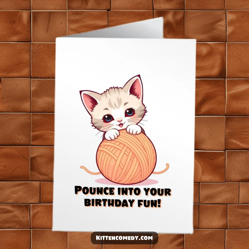 Funny Free Printable Kitten Birthday Card: A playful kitten leaping to pounce on a colorful, dancing ball of yarn.