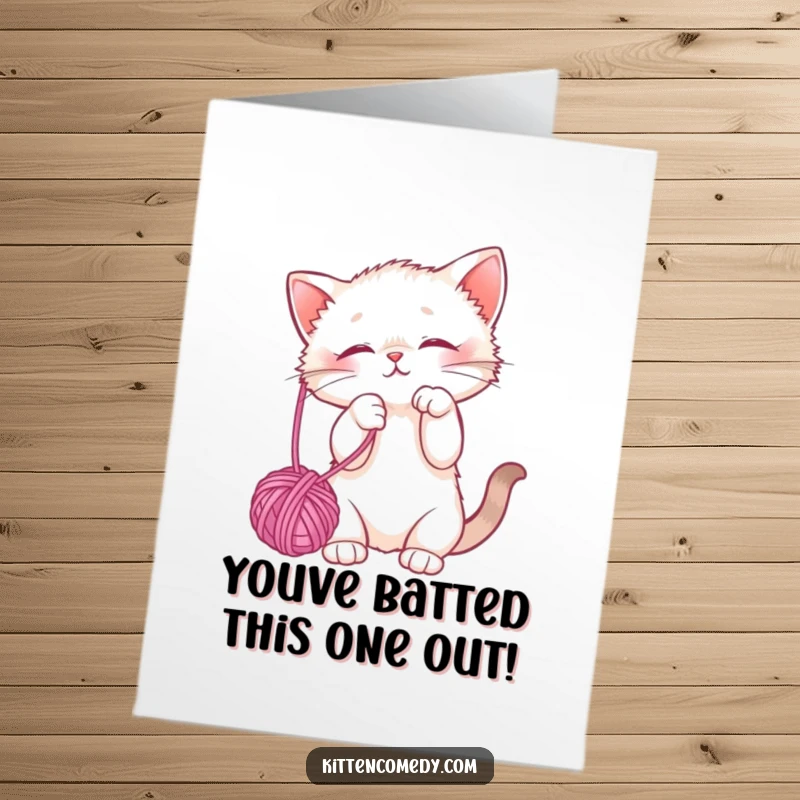 Funny Free Printable Congratulations Card showing a cute kitten playfully batting a dangling yarn ball, a delightful DIY greeting for any occasion.