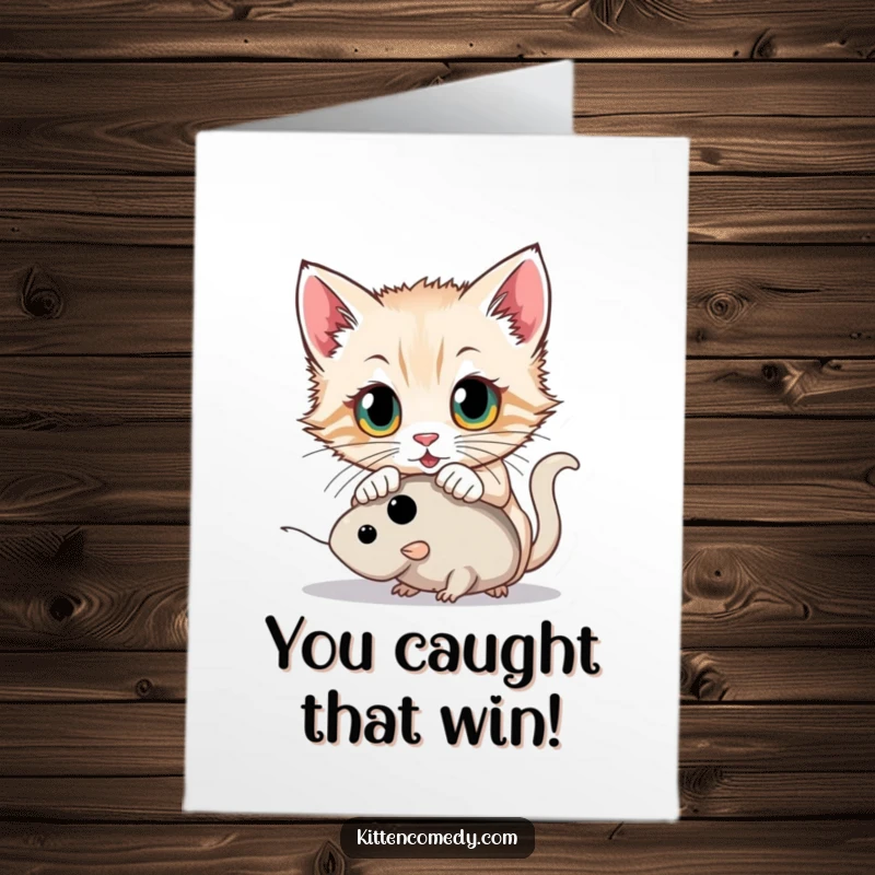 Funny Free Printable Congratulations Card showing a kitten with wide eyes pouncing on a toy mouse, symbolizing a successful catch.