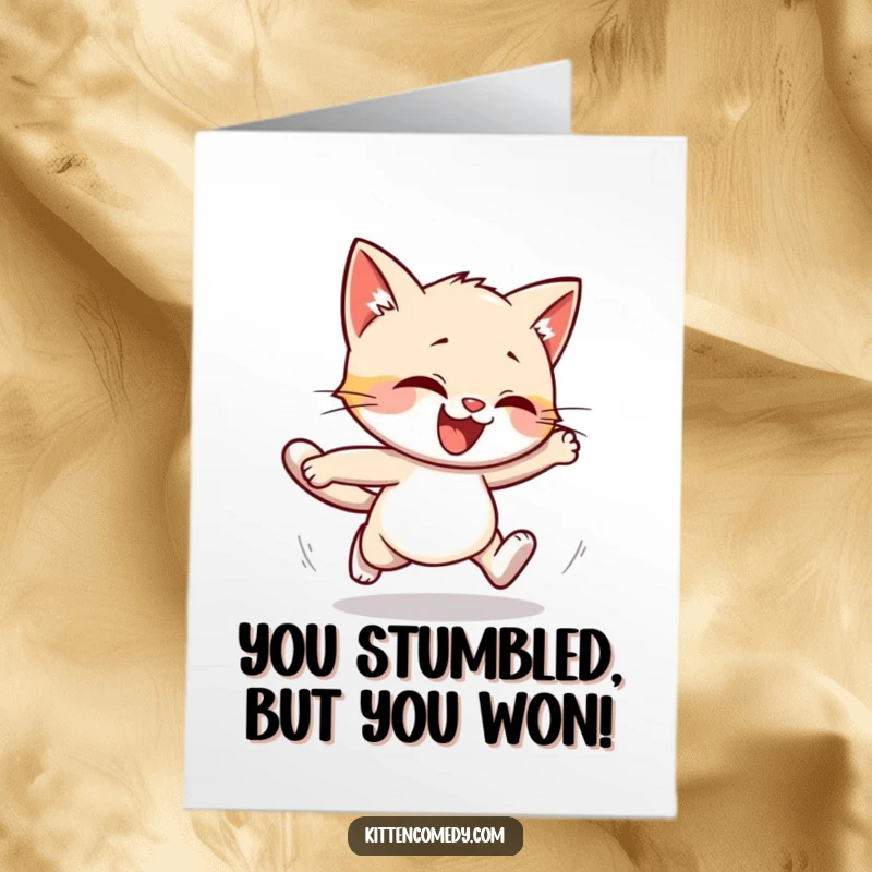 Funny Free Printable Congratulations Card featuring a kitten in a comical stumble during a run, symbolizing playful triumph.