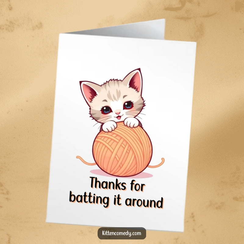 Funny Free Printable Thank You Card: An energetic kitten playfully pouncing on a colorful ball of yarn, sending thanks with glee.