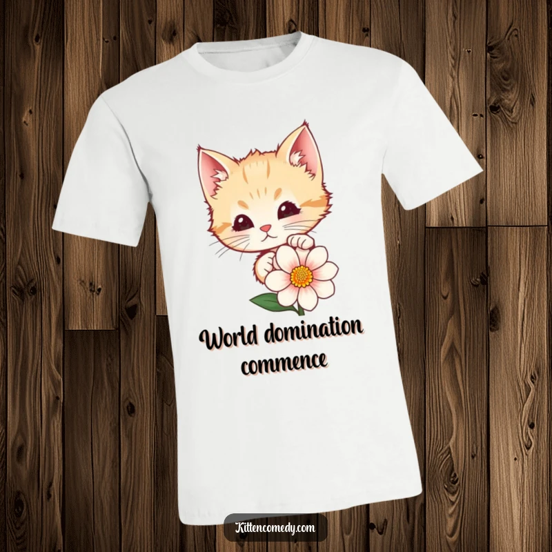 Funny t-shirt graphic of a cute kitten peeking with wide eyes from behind a colorful flower. Soft cotton tee for cat lovers.