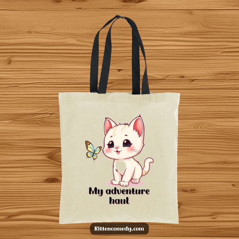 Funny kawaii kitten with excited eyes chasing a delicate butterfly, perfect for this spacious and humorous tote bag.