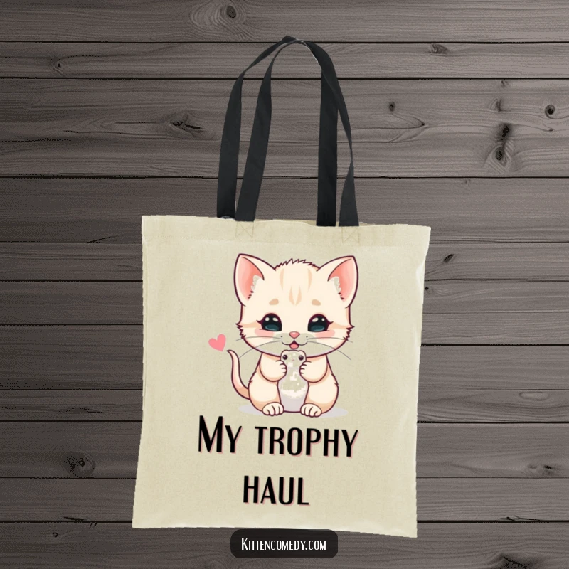 Funny tote bag featuring a kitten offering a toy mouse with a purr, perfect for carrying daily items with feline sweetness.