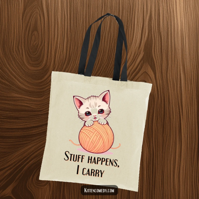Funny Tote Bag: A kitten energetically pounces on a ball of yarn. Perfect for carrying essentials and smiles.